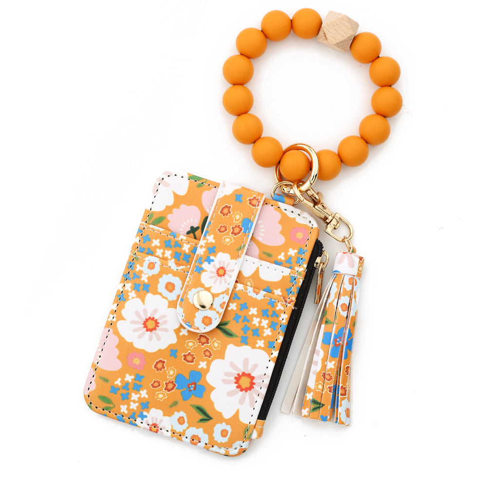 ID bag, silicone bracelet, floral folded edge card bag, TK printed leather wallet, keychain.